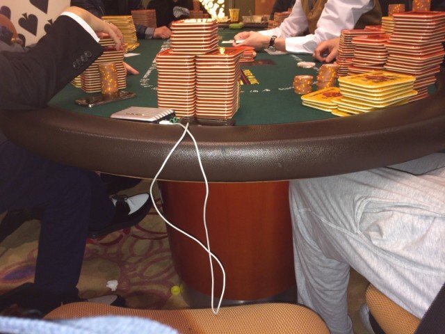 Stacks of poker chips covering the table during a high-stakes VIP game at StarWorld Casino in Macau