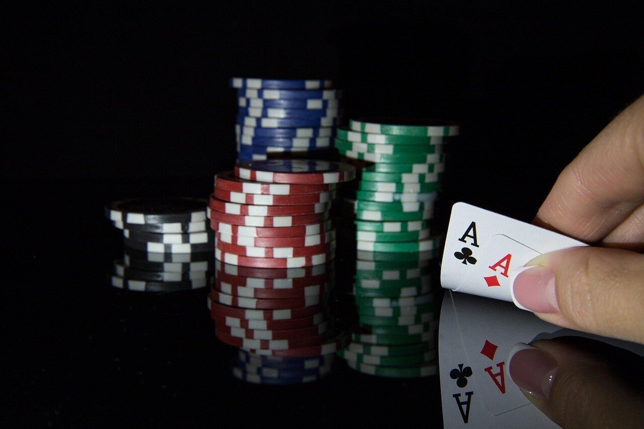 Poker chips and a double ace hand