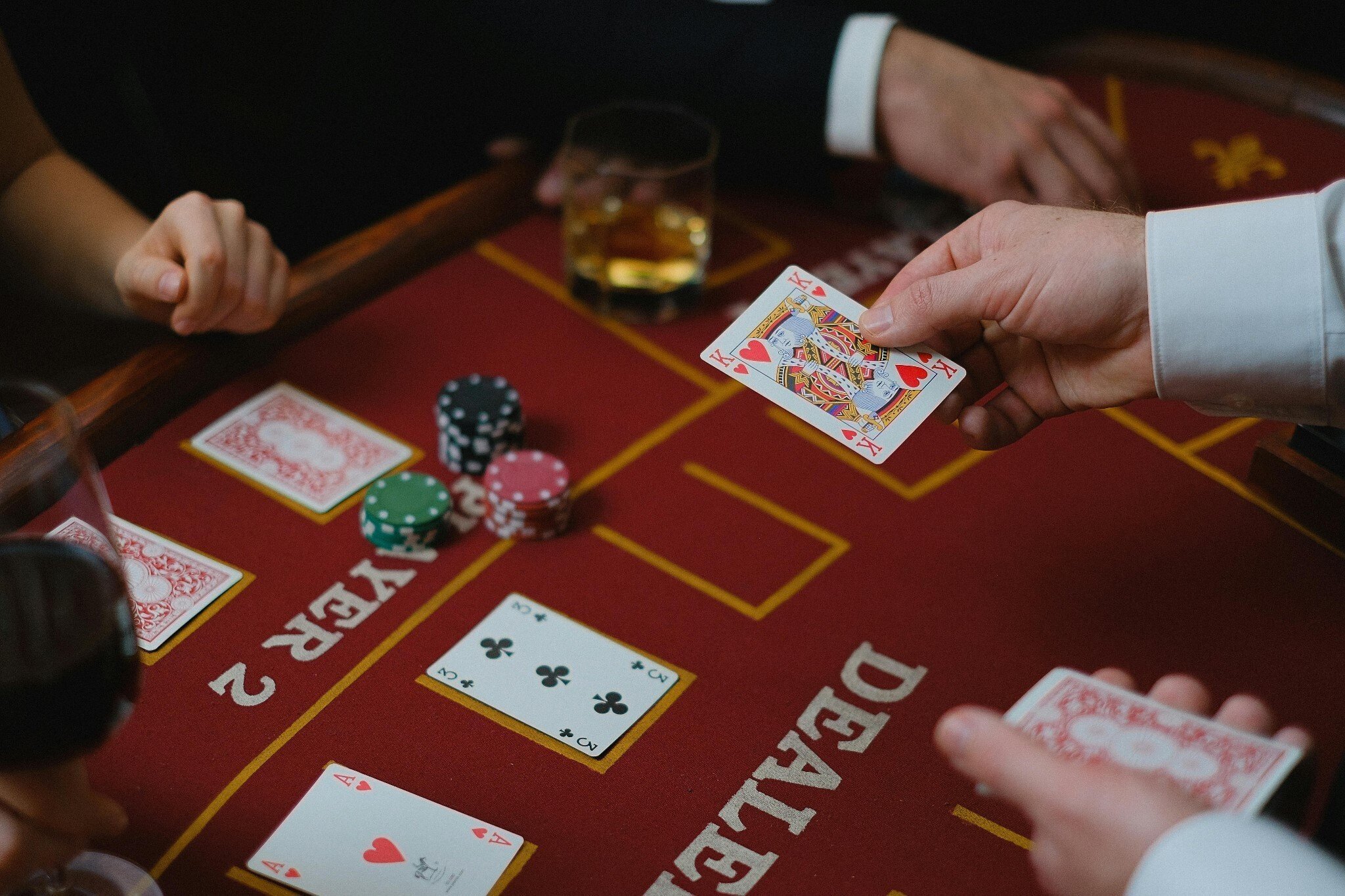 People practicing their card skills with blackjack